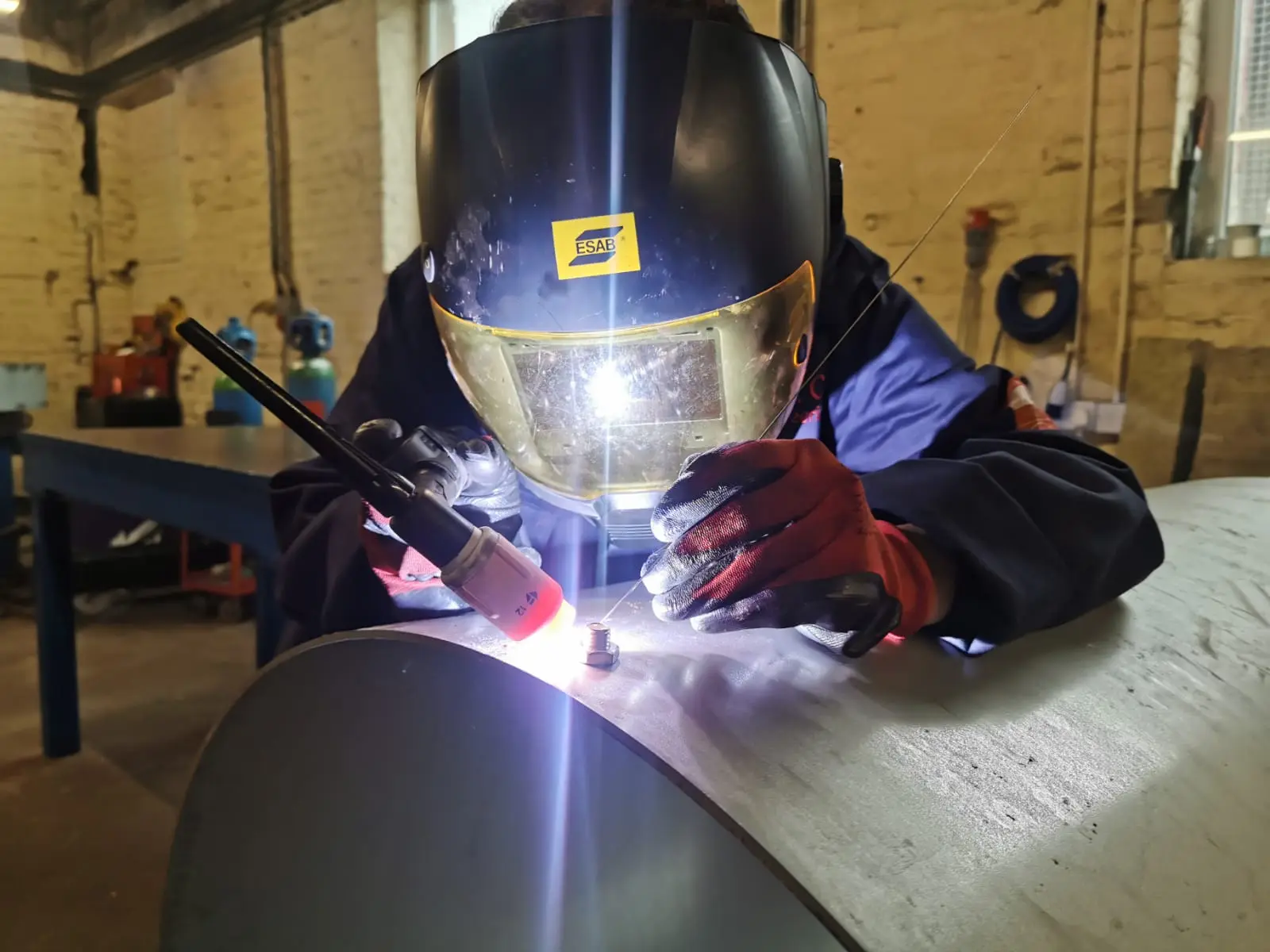 Worker doing pipework